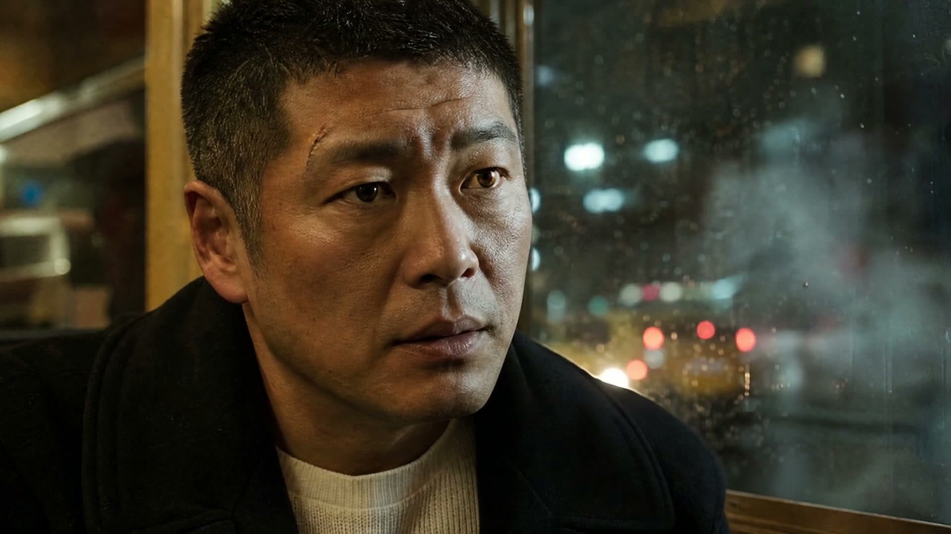 An original adult character in a cinematic diner close-up as a taxi passes the rain-streaked window